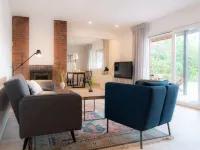 Spacious vacation apartment with garden, surrounded by greenery.
