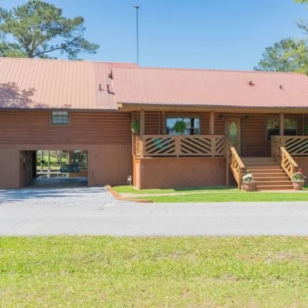 BEAUTIFUL WATERFRONT .  GNAT SCREENED BOATHOUSE AND AJOINING COVERED BOAT SLIPS
