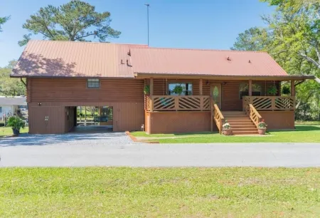 BEAUTIFUL WATERFRONT .  GNAT SCREENED BOATHOUSE AND AJOINING COVERED BOAT SLIPS