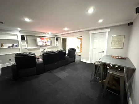 High-end home w/ fireplace, gourmet kitchen, sauna, game rm/ large yard/fire pit