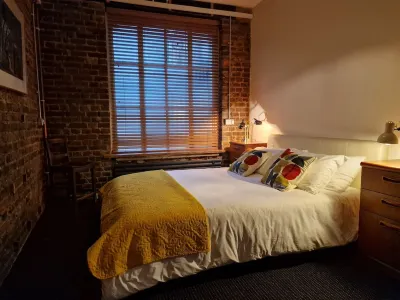 Spacious studio apartment with 20th Century Modern design in an industrial space