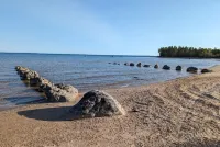 See the best of Michigan's Upper Peninsula in this Family Ready Lake-side Cabin