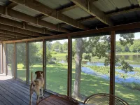 Relax at Grandma’s house with a screened in porch overlooking a private lake!