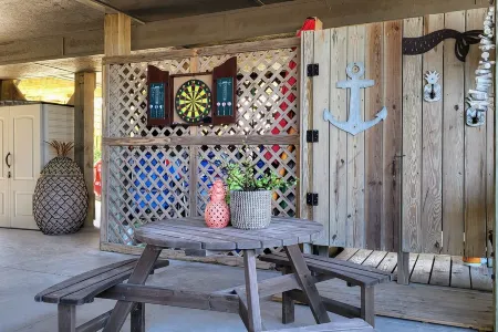 Beachfront 2-bedroom townhome, private beach access, outdoor space & amenities.