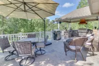 Lakehouse with covered dock, slide, and outdoor kitchen! Close to I-75, trails.