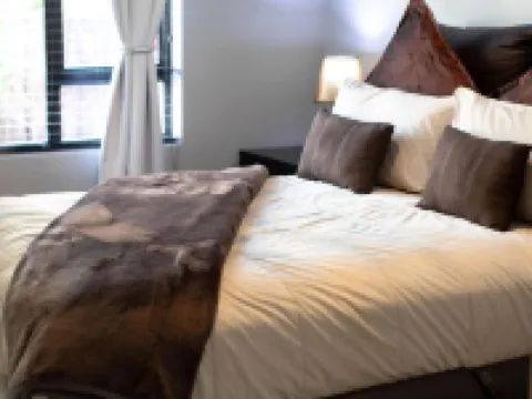 Luxury 2-Bedroom Apartment Near or Tambo with Private Garden & Heated Pool Hotels in Benoni