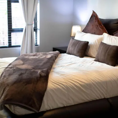 Luxury 2-Bedroom Apartment Near or Tambo with Private Garden & Heated Pool