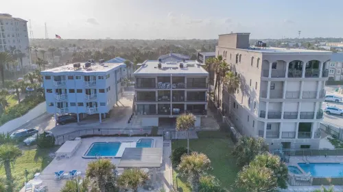 Stunning Ocean View and Pool Access - Charming Beachside Haven