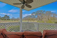 Balconies Overlooking Water and Golf Course - Cozy Beach Haven
