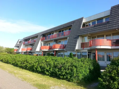 Ameland - apartment with balcony to the south side with a view of meadows and the village of Buren Hotels in Buren