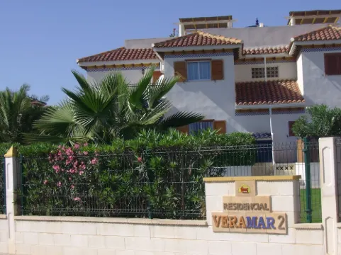 Living room with balcony and sea view, waterfront and south-facing