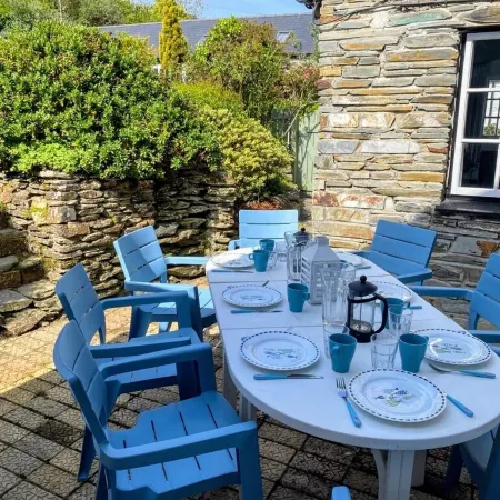 Charming  Listed Thatched Cottage with parking and short walk to sandy beach .