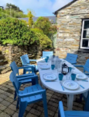 Charming  Listed Thatched Cottage with parking and short walk to sandy beach .