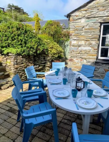 Charming  Listed Thatched Cottage with parking and short walk to sandy beach .