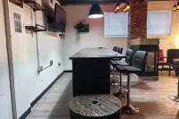 Charming Prohibition-Era Speakeasy Lounge with Bedroom and Commercial Kitchen
