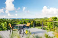 Tiny house on an acre with ocean view and private infinity pool.