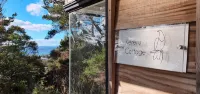 Kereru Cottage - private bach with sea view