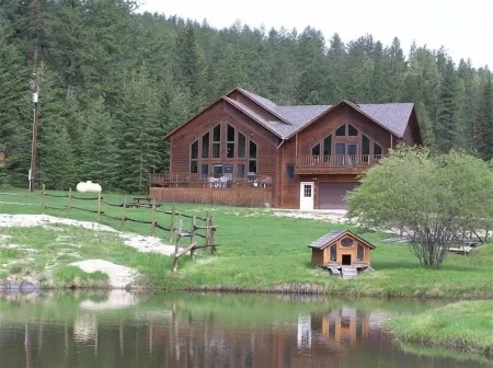 Large private lot.  Beautiful cabin with a stream and trout pond!