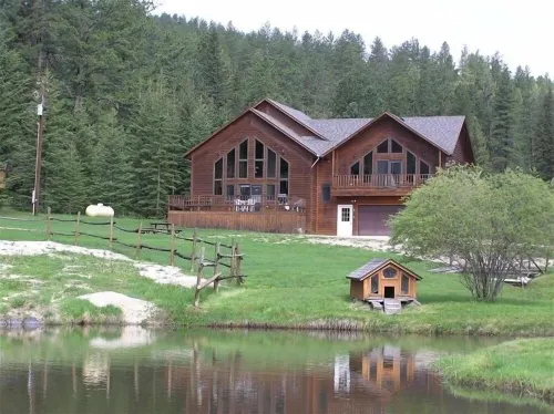 Large private lot.  Beautiful cabin with a stream and trout pond!
