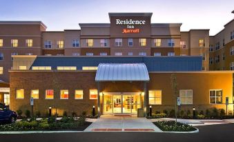 the exterior of a hotel called residence inn marriott , with its name displayed prominently at Residence Inn Riverside Moreno Valley