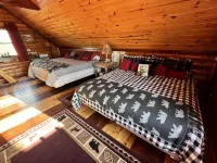 Log cabin on 9 acres. Perfect for a winter retreat or summer trip to the river.