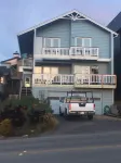 Beachfront home directly across from beach & park! Close to everything!
