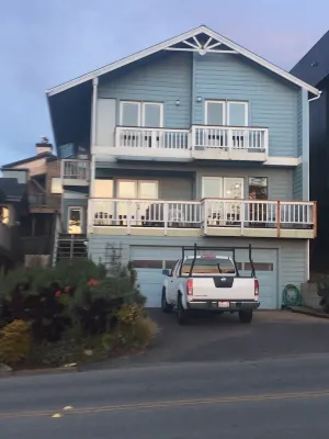 Beachfront home directly across from beach & park! Close to everything!