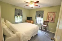 This charming  cozy cottage has a private hot tub, deck for fishing.
