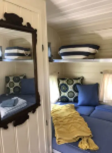 Glamping with sheep in a renovated 1972 Ace camper on 48 acres