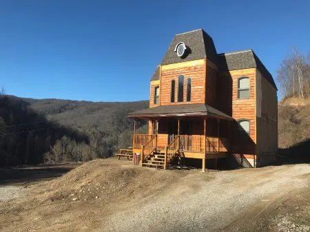 4BR 2 bath house with full kitchen, living room, hot tub and game room.