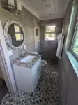 Remodeled Cabin on 40 private acres of Wind River frontage with R/V hookup.