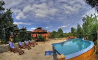 Pugdundee Safaris - Kanha Earth Lodge Hotels in Bhilewani