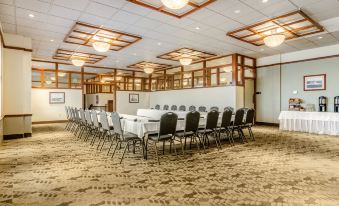 a large conference room with multiple rows of chairs arranged in a semicircle around a long table at The Inn at GIG Harbor