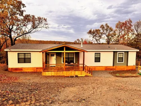 Lake front 4-bedroom house with fire pit and backyard path to the lake.