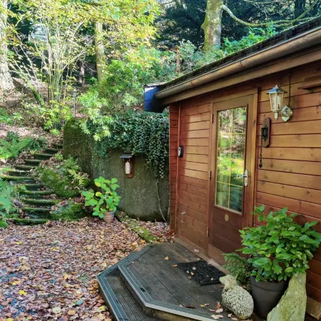 Luxury pine log cabin positioned within the mountains of the Lake District