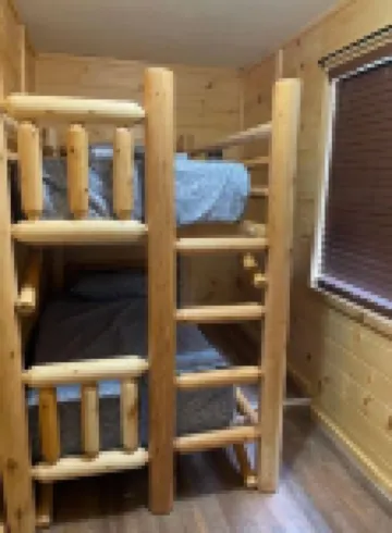 2BR 1 Bath cabin w/ full kitchen, hot tub, and living room.