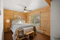 Cozy Log Cabin located on scenic acreage with trees and privacy.