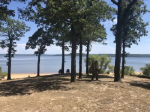 Private lakefront getaway with a sandy beach below the back deck!