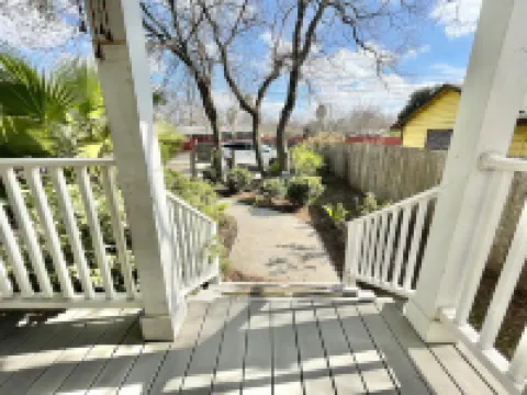 Private Parking and Sunny Front Porch - Charming Cottage Oasis