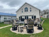 Relax at the outdoor firepit or hot tub overlooking all-sports Eight Point Lake!