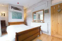 Waters edge boathouse  Rudyard lake   short breaks    kayaks  fishing hottub