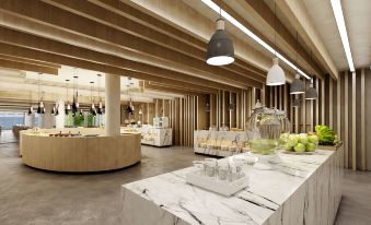 a modern , well - lit dining area with a marble table and chairs , as well as a bar area with a variety of beverages at Radisson Beach Resort Larnaca