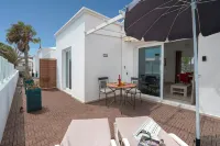 B1, in a small complex with communal heated pool 100m from the sea