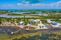 Wide Horizon oceanfront.  4 bedroom, 4 ½ bath,  kayaks, pool + observation deck.