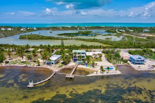 Wide Horizon oceanfront.  4 bedroom, 4 ½ bath,  kayaks, pool + observation deck.