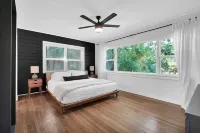 Mid-Century Boho Chic home with Pool, Game Room & Outdoor Playhouse.