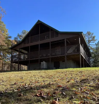 Beautiful cabin with fireplace and wrap around porch and private upstair balcony