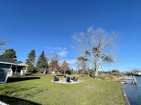 Cozy riverfront cottage with an easy beach-inspired coastal MI vibe!