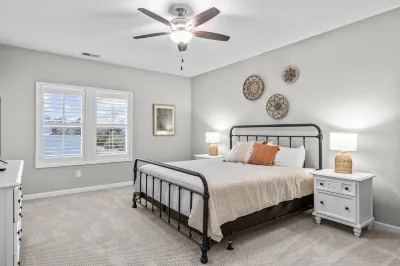 Coastal townhome with outdoor living, central AC, washer/dryer, & pool access