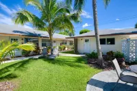 Modern condo near towering palms with beach decor, grill, & yard - walk to beach